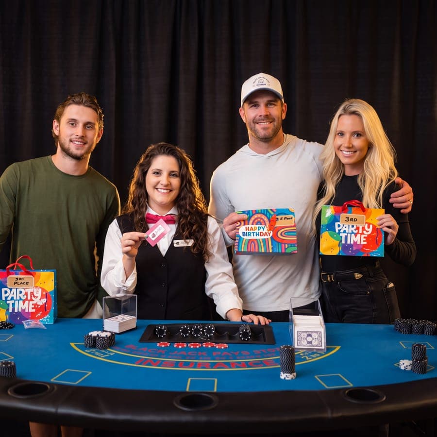 Guests holding prize gift bags with their Echo dealer at the table